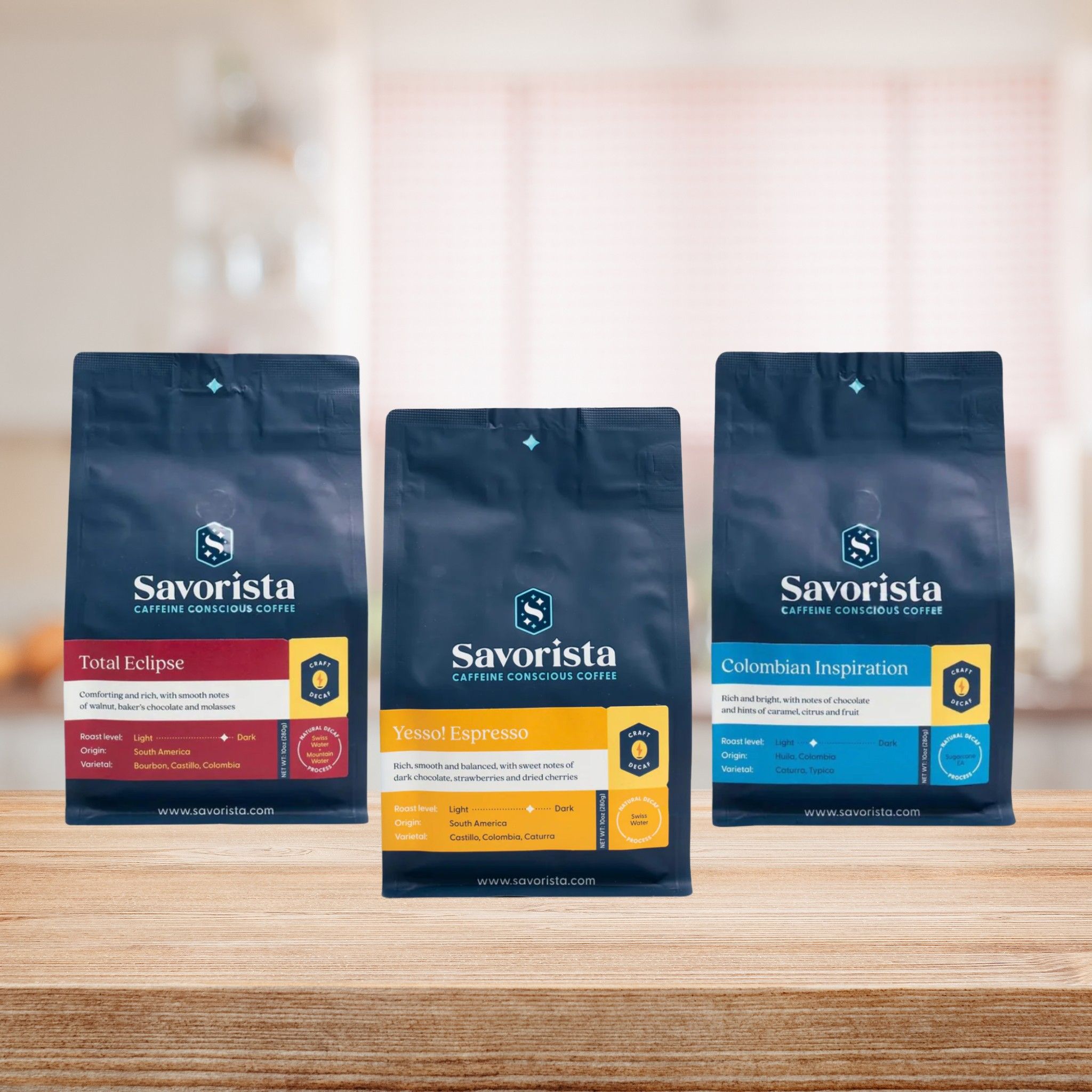 Three bags of Savorista coffee on a wooden shelf