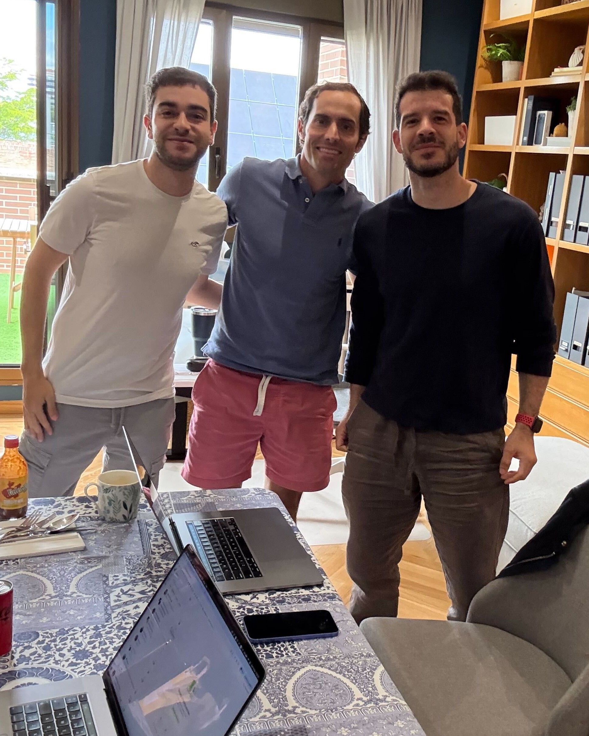 Members of the Awtomic team at a working session around their laptops